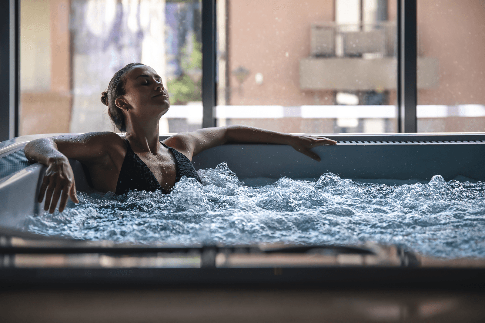 A woman relaxing in a hot tub
